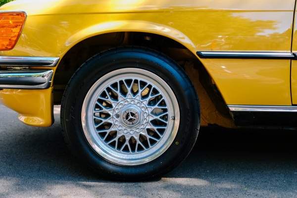 front wheel of a yellow car